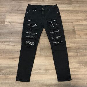 AMIRI Black Distressed Skinny Jeans